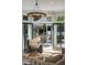 Cozy living room leading to outdoor kitchen with built-in grill and ample seating at 725 Riley Pl, Atlanta, GA 30327