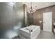 Spa-like bathroom featuring a modern soaking tub and a glass-enclosed shower at 1276 Edmund Ne Ln, Brookhaven, GA 30319