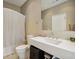 Well-lit bathroom featuring a modern sink and fixtures, a tile wall and neutral decor at 1276 Edmund Ne Ln, Brookhaven, GA 30319