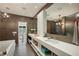 Contemporary bathroom with dual sinks, a large mirror, and modern fixtures at 1276 Edmund Ne Ln, Brookhaven, GA 30319
