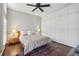 Bedroom featuring a ceiling fan, shuttered windows, a comfy rug, and built in closet at 1276 Edmund Ne Ln, Brookhaven, GA 30319
