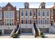 Charming brick townhomes with stone accents and individual garages at 1276 Edmund Ne Ln, Brookhaven, GA 30319