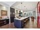 Modern kitchen with sleek black cabinetry, white countertops, and island seating at 1276 Edmund Ne Ln, Brookhaven, GA 30319