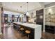 Contemporary kitchen with a long island, pendant lights, and adjacent dining area at 1276 Edmund Ne Ln, Brookhaven, GA 30319
