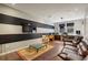 Living room with large windows, a striped wall, a comfortable couch and a glass coffee table at 1276 Edmund Ne Ln, Brookhaven, GA 30319