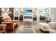 Spacious living room with a view of the kitchen, a sleek fireplace, and hardwood flooring at 1276 Edmund Ne Ln, Brookhaven, GA 30319
