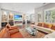 Inviting living area with built-in shelving, fireplace, large windows, and comfortable seating at 1276 Edmund Ne Ln, Brookhaven, GA 30319