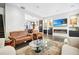 Relaxing living room with hardwood floors, sleek fireplace, large TV, and comfortable seating arrangements at 1276 Edmund Ne Ln, Brookhaven, GA 30319