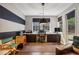 Home office with large windows, black out shades, a striped wall and a director's chair at 1276 Edmund Ne Ln, Brookhaven, GA 30319
