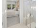 Bathroom featuring glass-enclosed shower with seat and a view of the connected bedroom at 1407 Bluffs Ridge Way, Canton, GA 30114