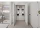 Clean, bright bathroom featuring a glass-enclosed shower and convenient linen storage at 1407 Bluffs Ridge Way, Canton, GA 30114