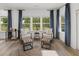 Charming sitting area with natural light, comfortable chairs, and a view of the outdoors at 1407 Bluffs Ridge Way, Canton, GA 30114