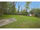Wide backyard offers ample green space plus a shed with a concrete slab at 2610 Knoll Se Rd, Smyrna, GA 30080