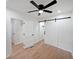 Bedroom with ceiling fan, sliding barn door and two standard interior doors at 2610 Knoll Se Rd, Smyrna, GA 30080