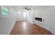Bright bedroom with hard wood floors, three windows, ceiling fan and built-in electric fireplace at 2610 Knoll Se Rd, Smyrna, GA 30080