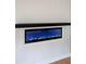 Electric fireplace with a sleek black mantle, set in a bright white wall at 2610 Knoll Se Rd, Smyrna, GA 30080
