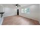 Bright open living room with wood floors, fireplace, and a view to the front yard at 2610 Knoll Se Rd, Smyrna, GA 30080