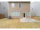 A view of the backyard with a concrete patio and a freshly-maintained lawn at 275 Denver Ave, Hiram, GA 30141