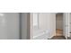 Bathroom featuring a soaking tub, separate shower, and a window at 275 Denver Ave, Hiram, GA 30141