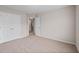 Spacious carpeted bedroom featuring neutral paint and a double door closet for storage at 275 Denver Ave, Hiram, GA 30141