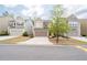 Street view of three craftsman homes in a neighborhood setting, with well-kept lawns and driveways at 275 Denver Ave, Hiram, GA 30141