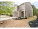 Angle view of a two-story home showcasing tidy landscaping, attached garage, and brown siding at 275 Denver Ave, Hiram, GA 30141