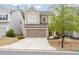 Charming two-story home featuring a two-car garage, neutral siding, and a well-manicured front yard at 275 Denver Ave, Hiram, GA 30141