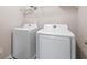 Well-equipped laundry room with modern, white washer and dryer units for efficient laundry care at 275 Denver Ave, Hiram, GA 30141