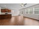 Open-concept living area featuring a kitchen with dark cabinets and stainless steel appliances at 275 Denver Ave, Hiram, GA 30141