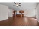 Open-concept living area showcasing the kitchen with dark cabinets and stainless steel appliances at 275 Denver Ave, Hiram, GA 30141