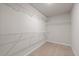 Spacious walk-in closet with carpeted floors and wire shelving for optimal organization and storage at 275 Denver Ave, Hiram, GA 30141