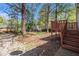 Backyard with small deck, featuring a spacious yard and storage sheds at 3742 Linecrest Rd, Ellenwood, GA 30294