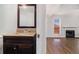 Bathroom vanity featuring granite counters and wooden cabinetry in neutral colors at 3742 Linecrest Rd, Ellenwood, GA 30294