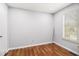 Bedroom featuring wood floors and a bright window at 3742 Linecrest Rd, Ellenwood, GA 30294