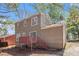 Two story home with a red back deck and neutral toned siding at 3742 Linecrest Rd, Ellenwood, GA 30294
