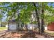 Charming two-story home featuring a manicured lawn, attached garage, and traditional architectural details at 3742 Linecrest Rd, Ellenwood, GA 30294