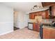 Well-equipped kitchen with modern appliances, tile floors, sleek granite countertops, and stylish cabinetry at 3742 Linecrest Rd, Ellenwood, GA 30294
