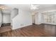 Spacious living room featuring sleek hardwood floors, neutral walls, and a view of the stairway at 3742 Linecrest Rd, Ellenwood, GA 30294