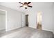 Spacious main bedroom with neutral paint, carpet, and multiple doors and entryways at 3742 Linecrest Rd, Ellenwood, GA 30294