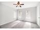 Main bedroom featuring carpet, ceiling fan, and natural light from a pair of windows at 3742 Linecrest Rd, Ellenwood, GA 30294