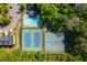 Aerial view of the community pool and tennis courts with mature landscaping at 4735 Longcourt Se Dr, Atlanta, GA 30339