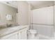 Updated bathroom features a single sink vanity with marble countertops, and shower at 4735 Longcourt Se Dr, Atlanta, GA 30339