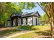 Community clubhouse with meticulously maintained lawn and landscaping at 4735 Longcourt Se Dr, Atlanta, GA 30339