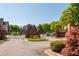 Gated community entrance with brick signage and beautifully landscaped grounds at 4735 Longcourt Se Dr, Atlanta, GA 30339