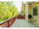 Cozy deck with wood railings overlooks the lush greenery at 4735 Longcourt Se Dr, Atlanta, GA 30339