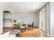 Dining room with light hardwood floors, stylish lighting, and lots of natural light at 4735 Longcourt Se Dr, Atlanta, GA 30339