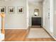 Charming entryway showcases hardwood floors, and a sleek storage cabinet, enhanced by natural light at 4735 Longcourt Se Dr, Atlanta, GA 30339