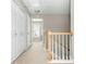 Bright hallway with white doors and staircase at 4735 Longcourt Se Dr, Atlanta, GA 30339