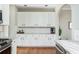 Bright kitchen features white cabinets, subway tile backsplash, and stainless steel appliances at 4735 Longcourt Se Dr, Atlanta, GA 30339