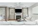 Living room featuring a fireplace with built-ins, neutral decor, and french doors to the backyard at 4735 Longcourt Se Dr, Atlanta, GA 30339